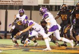 Peyton Hendrickson makes a key tackle in playoff tilt against McClymonds High school Friday night in Oakland. 